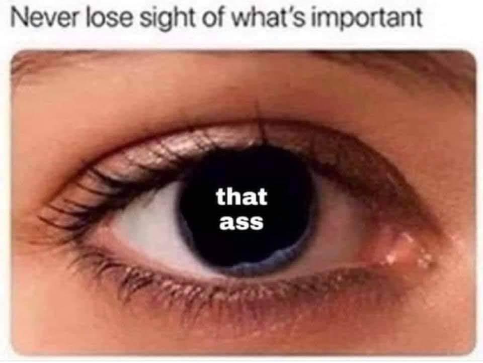A close-up image of a human eye with the pupil digitally replaced by the text 'that ass'. Above the eye, the phrase 'Never…