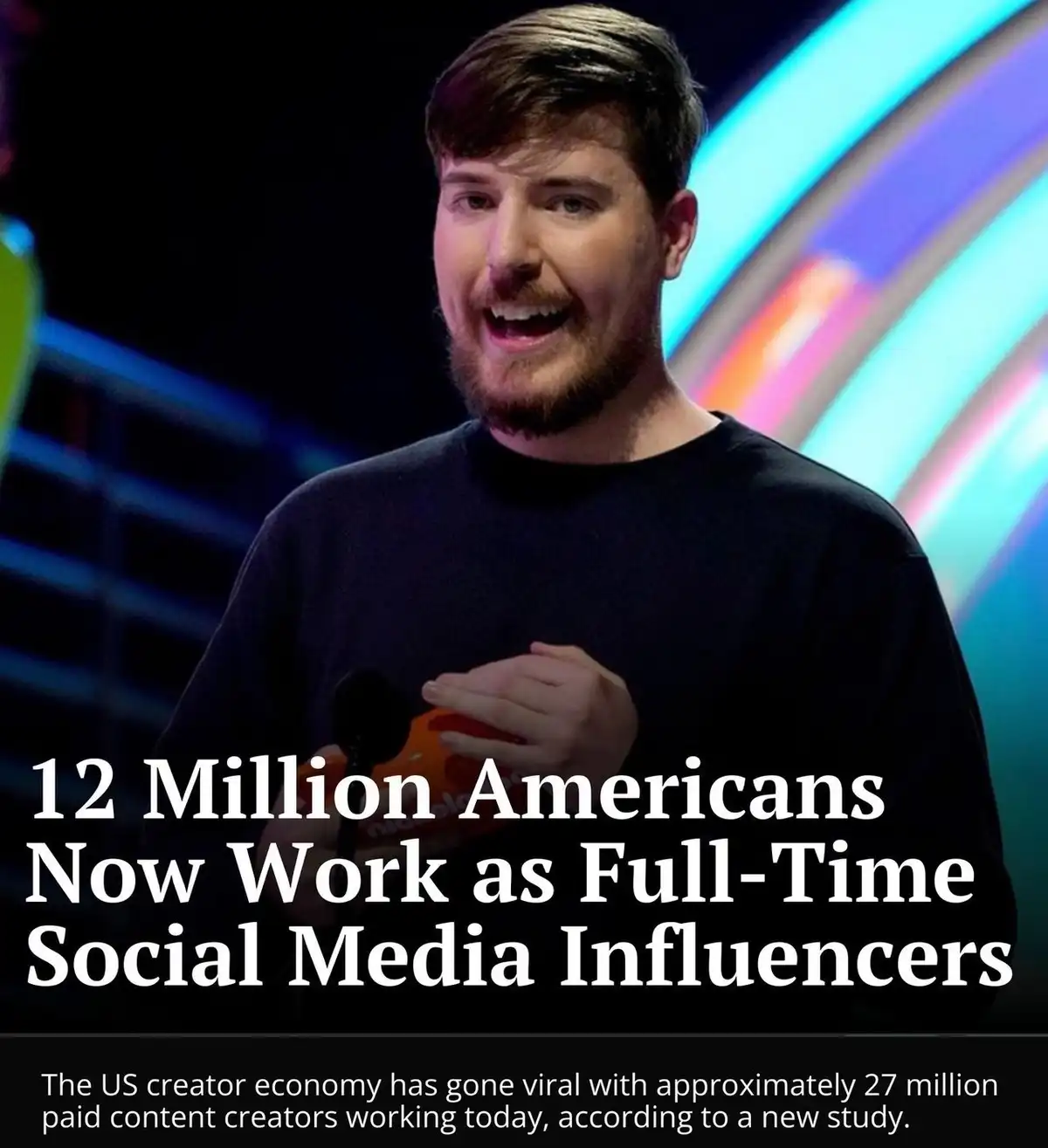 A man with a beard and dark shirt is shown on stage with colorful lights behind him, holding a microphone. Overlaid white…