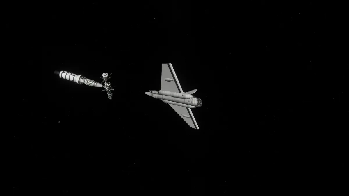 An image shows a space shuttle and a fighter jet side-by-side in outer space against a starry black background. The fighter…