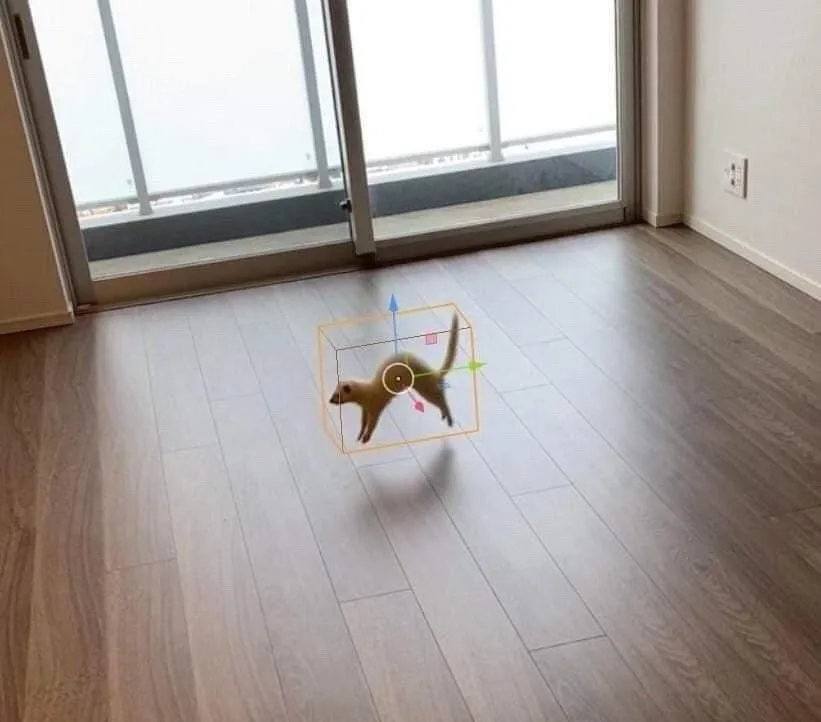 a small meerkat stands on a wooden floor in front of glass doors, overlaid with a 3d modeling axis box and directional…