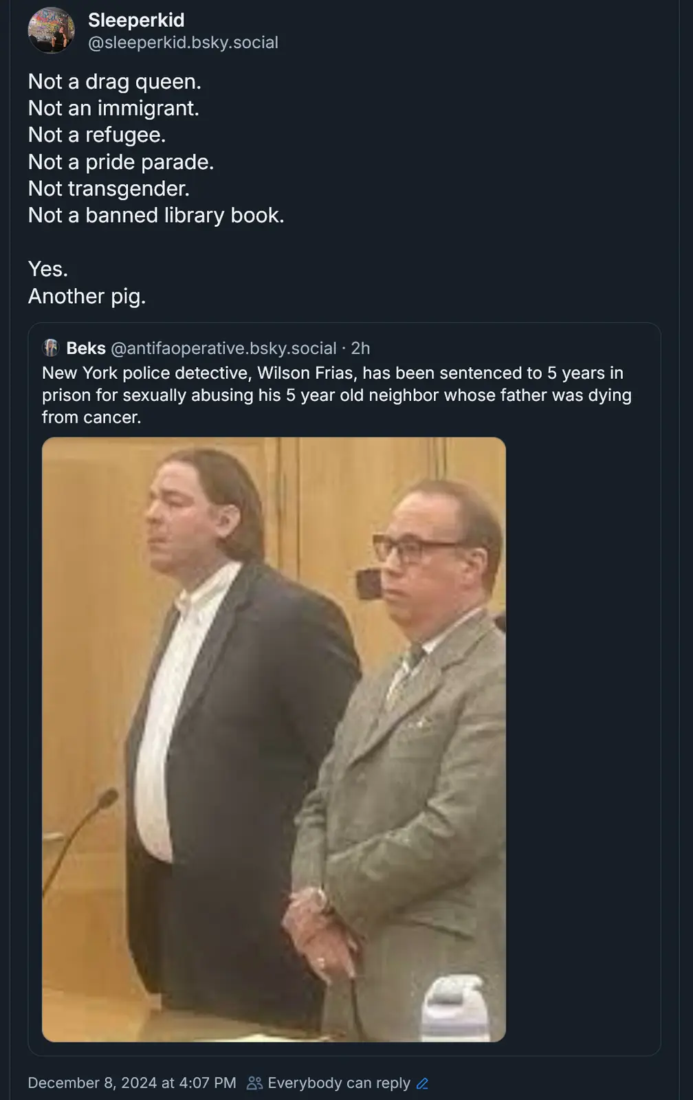 A screenshot of a social media post showing a photo of two men in suits standing in what appears to be a courtroom. The post…