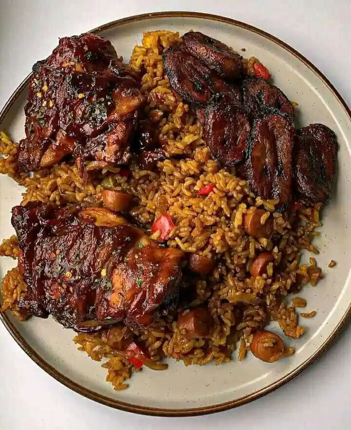 A Flavorful Feast: Jellof Rice with Fried Plantain and Chicken