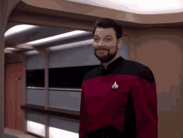 A six-panel sequence from Star Trek: The Next Generation shows a man in a red Starfleet uniform initially smiling at the…