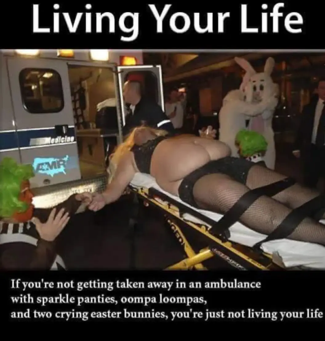 A woman in sparkly black lingerie and fishnet stockings is strapped to a yellow stretcher being loaded into an ambulance…
